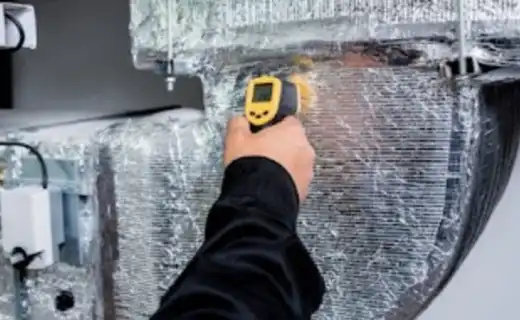 Infrared thermometer used to diagnose an HVAC duct and system issue